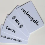 Customizable nfc cards arranged in a fanned-out manner, with the text "customizable nfc cards add your design" on each card.