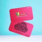 Pink NFC-enabled business cards with "V CARD - Tap, Share, Connect" text, a QR code in the shape of a cloud, and a web address and ID at the bottom.