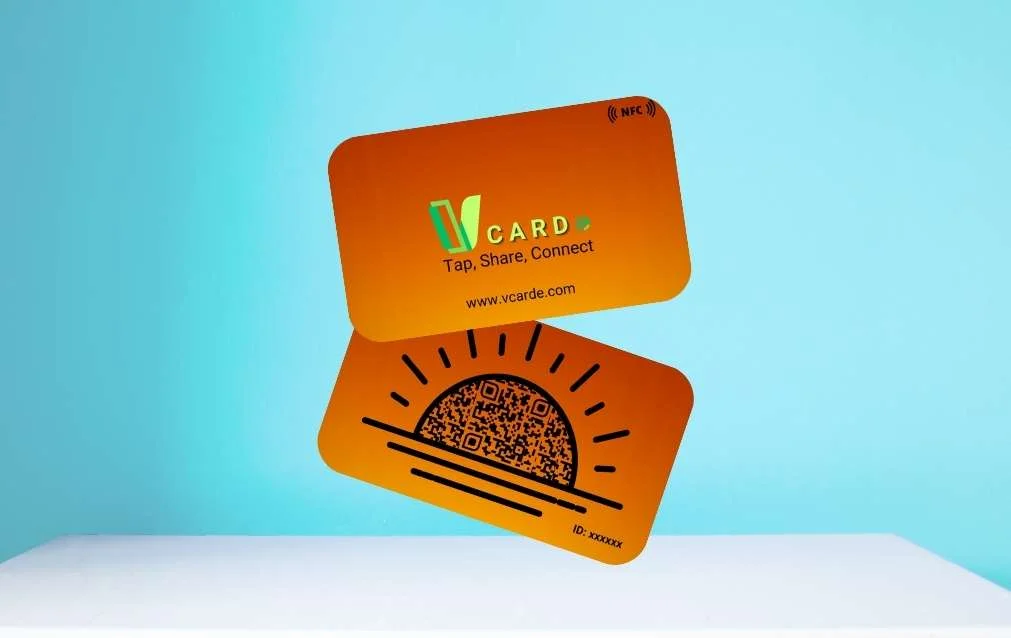 Orange vcard with "vcard: tap, share, connect" text, nfc symbol, and website url on the front; qr code and id number on the back.